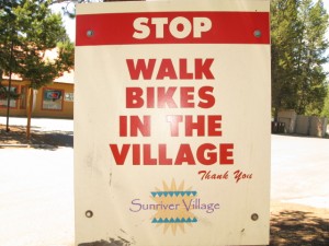 Walk Bikes In Village Sign